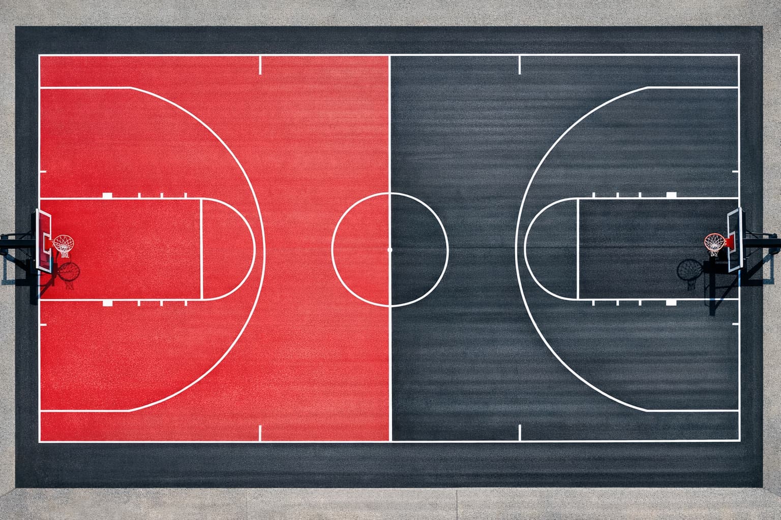 Regulation outdoor concrete basketball court with official NBA line markings — 94x50 ft with three-point arcs, paint, center circle, and all court lines