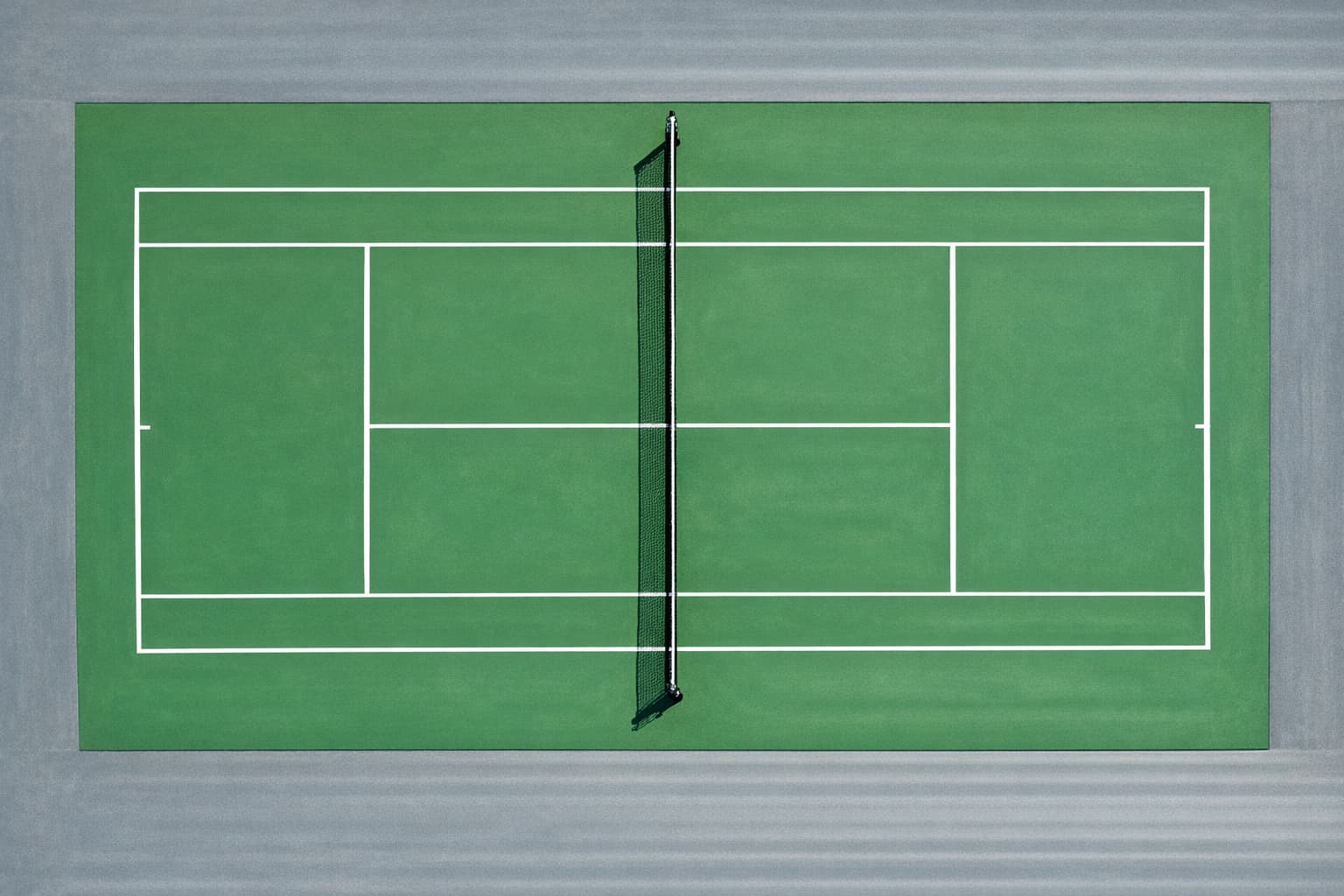 Regulation outdoor concrete tennis court with official ITF line markings — 78x36 ft doubles court with service boxes, sidelines, and center service line